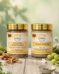Two jars of Deshla herbal products on a wooden surface with greenery in the background.