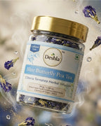 Jar of Deshla Blue Butterfly Pea Tea with flowers around it