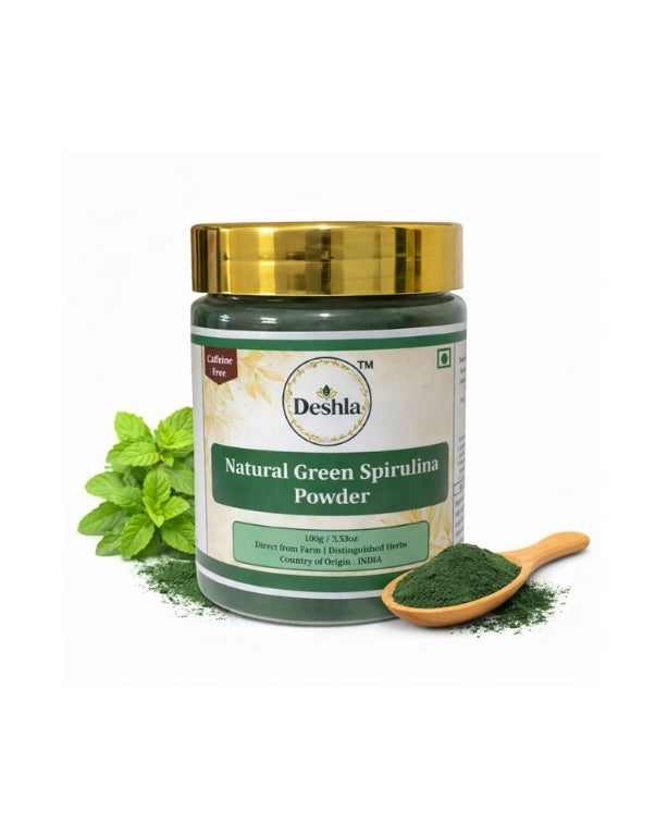 Deshla Natural Green Spirulina Powder with a spoonful of powder and green leaves on a white background