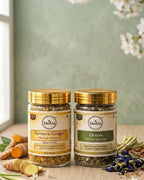 Two jars of Deshla herbal infusions on a wooden surface with a green background.