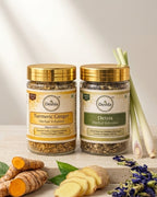 Two jars of Deshla herbal infusions with turmeric and ginger on a wooden surface.