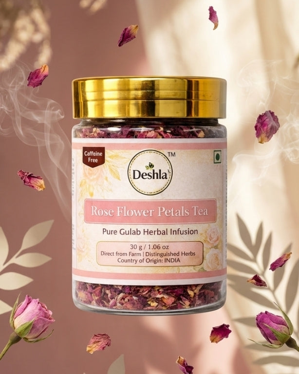 Jar of Deshla Rose Flower Petals Tea with gold lid on a pink background with scattered rose petals.