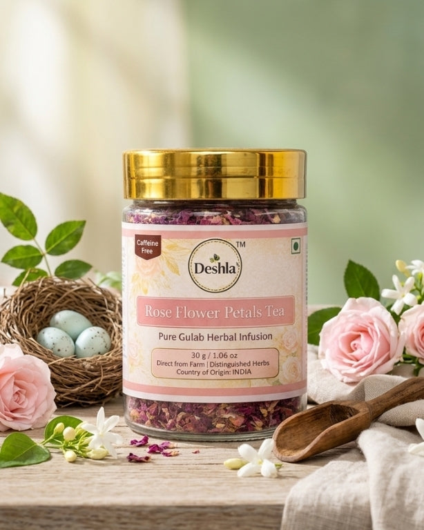 Jar of Deshla Rose Flower Petals Tea on a wooden surface with flowers and a nest in the background