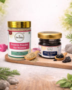 Two jars of Deshila products on a wooden tray with natural elements in the background